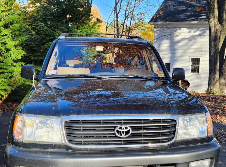 Rust repair and windshield replacement on a 2000 Toyota Land Cruiser.